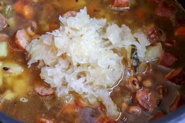 Picture of sauerkraut in soup in a large saucepan