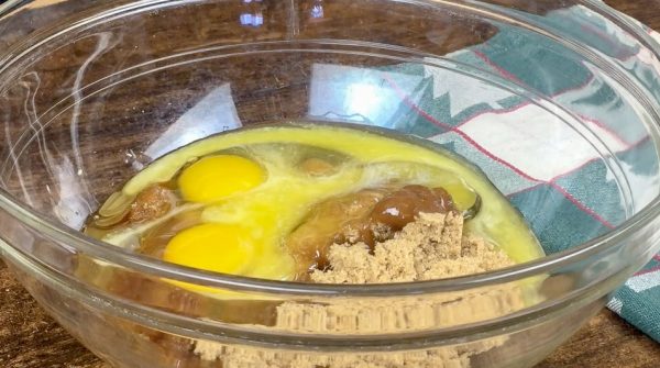 Picture of eggs and butter and brown sugar in a bowl