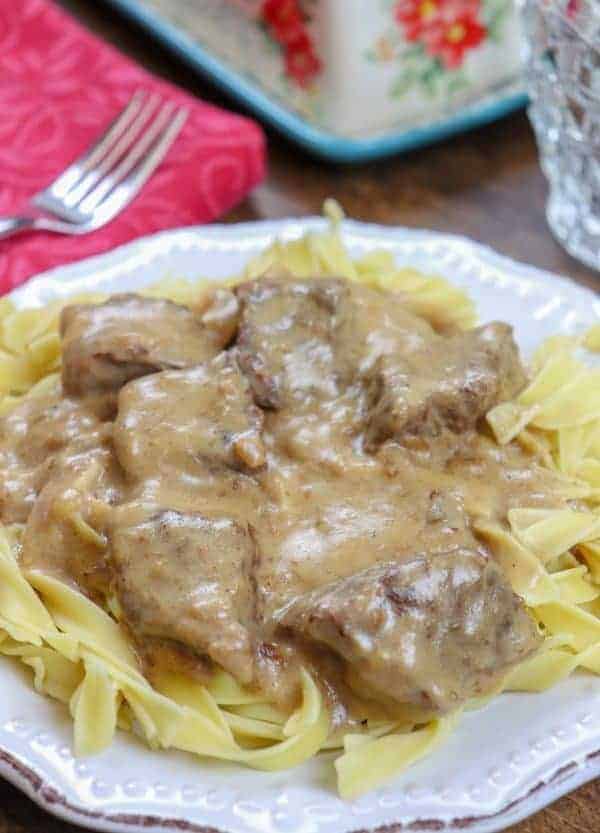 Picture of beef and noodles on a white plate