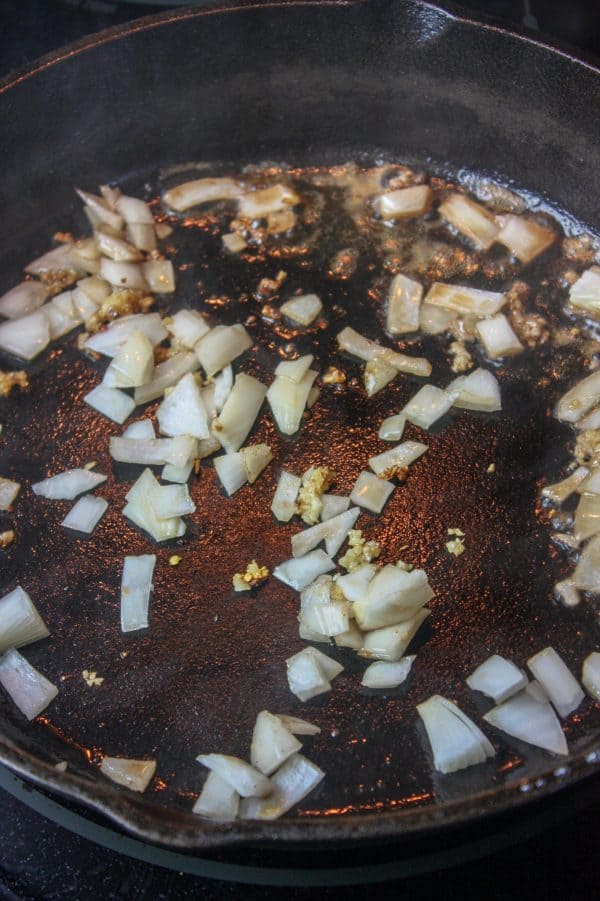 Picture of onion sautéing in a skillet