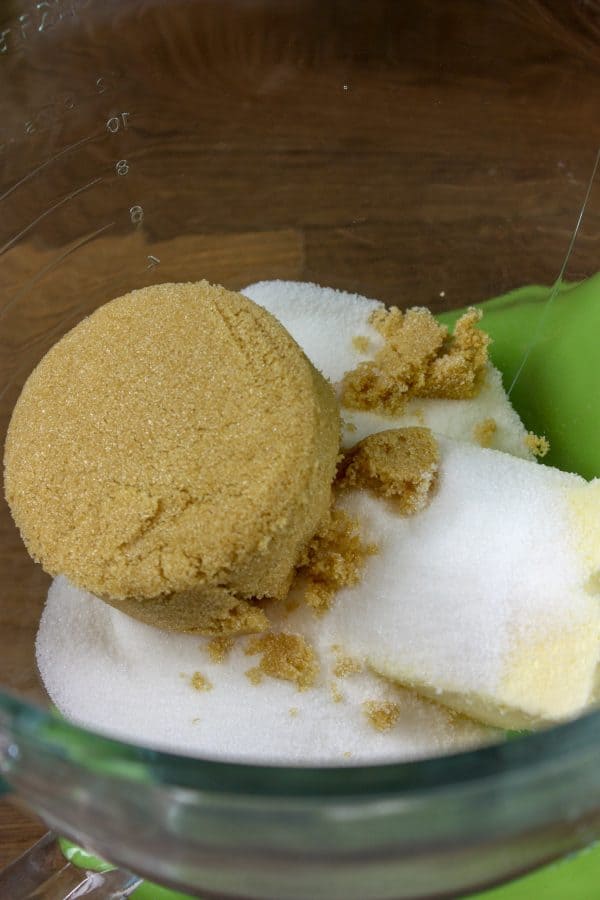 Picture of brown and white sugar in a bowl.