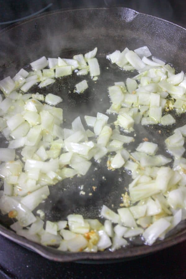 Picture of garlic and onions in a skillet.