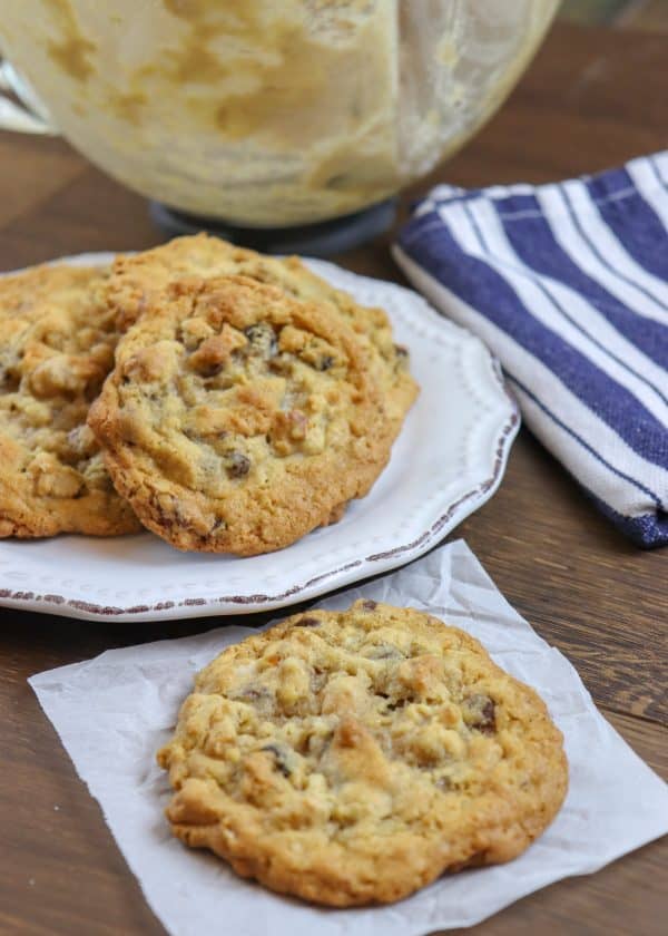 Picture of cookies on a piece of parchment paper and a plate.