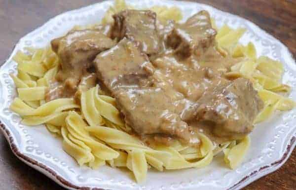 Picture of beef and noodles on a white plate