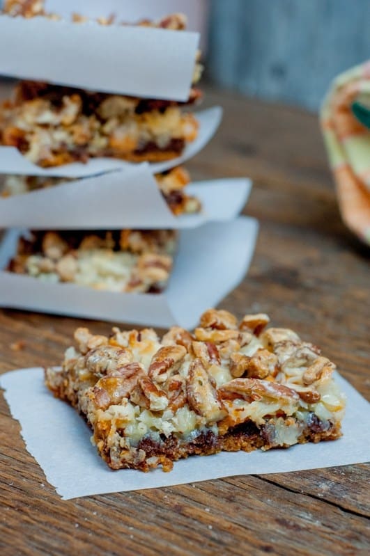 Picture of seven layer bars on parchment paper