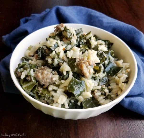 Bowl of collards with rice and Italian sausage