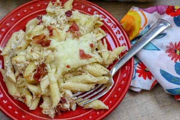 Picture of penne pasta on a red plate