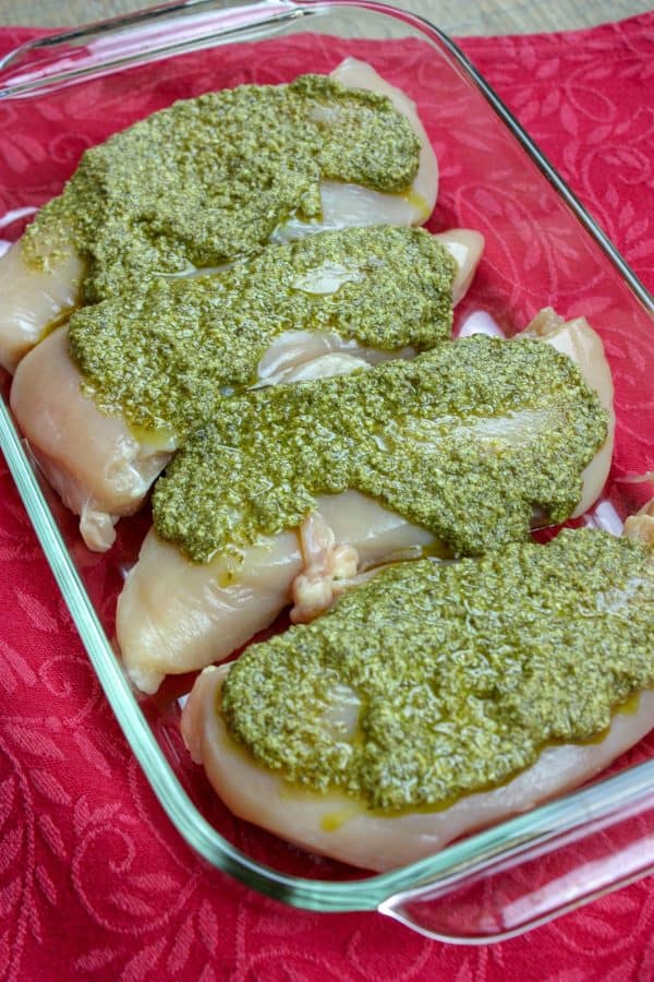 Picture of chicken with pesto sauce.