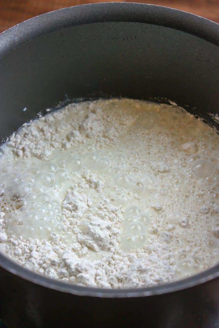 Picture of milk in a saucepan.