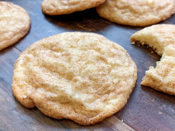 Snickerdoodle cookies sitting on a brown board