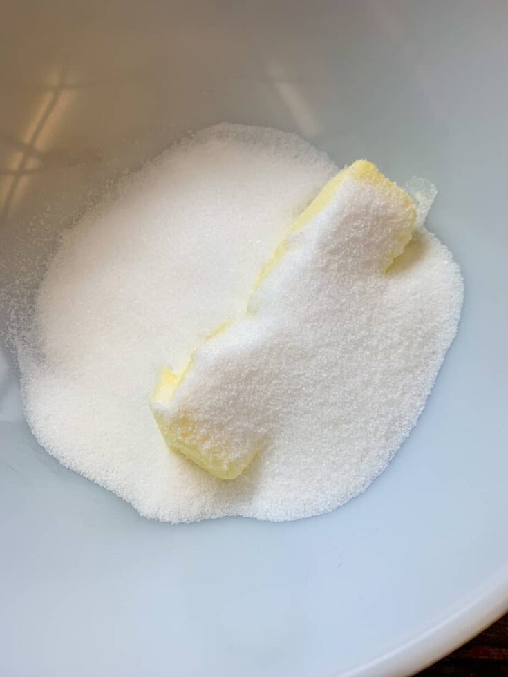 Sugar and butter inside of a white bowl