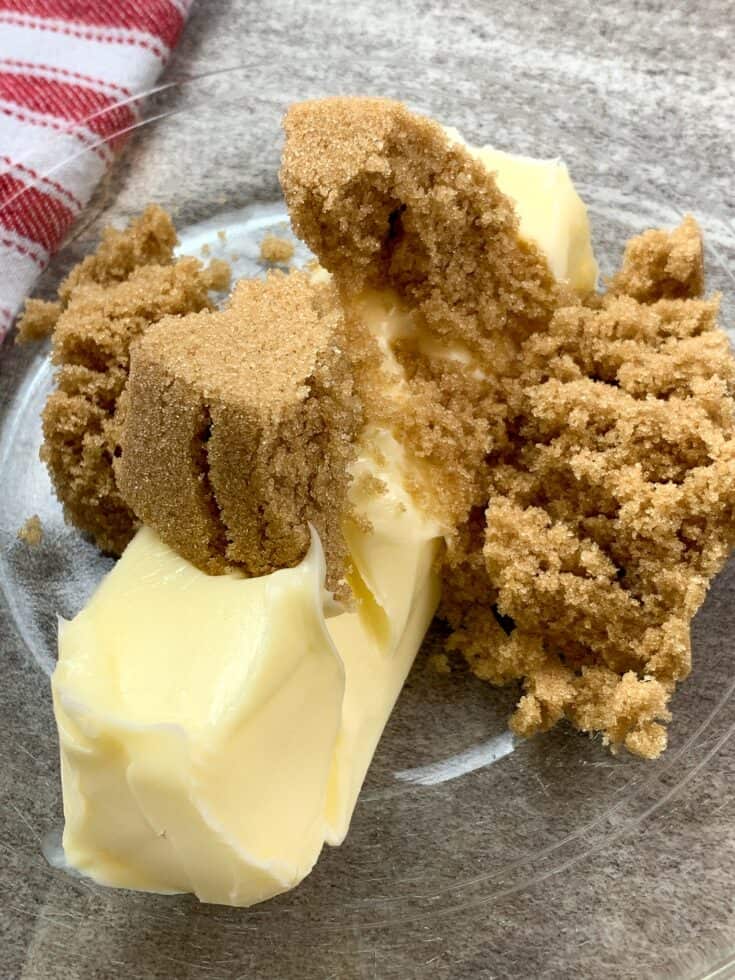 Softened butter and brown sugar in a glass bowl