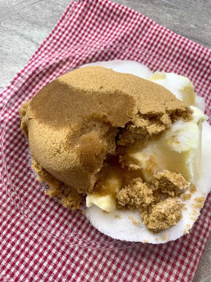 Brown sugar, vanilla, sugar, and butter in a glass bowl