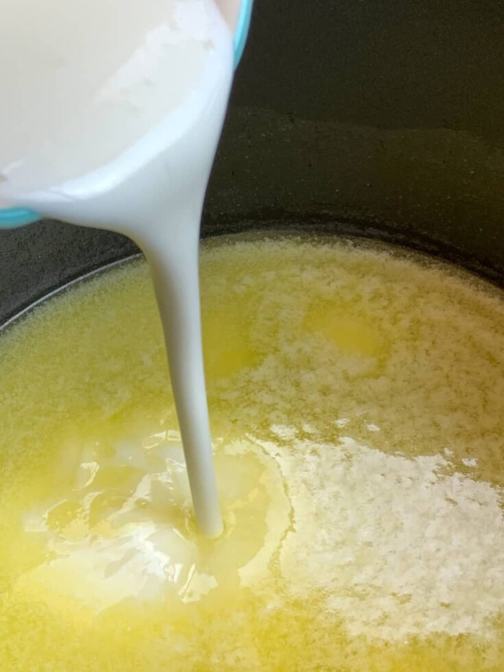 Buttermilk being poured into butter