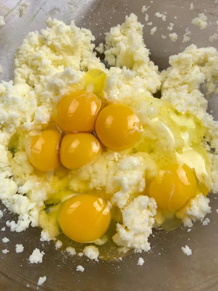 Eggs, sugar, butter in a glass bowl