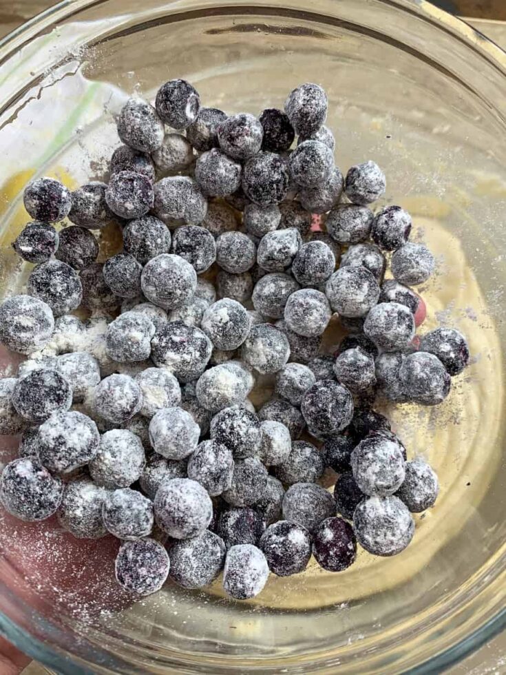 Blueberries with flour on top in a bowl