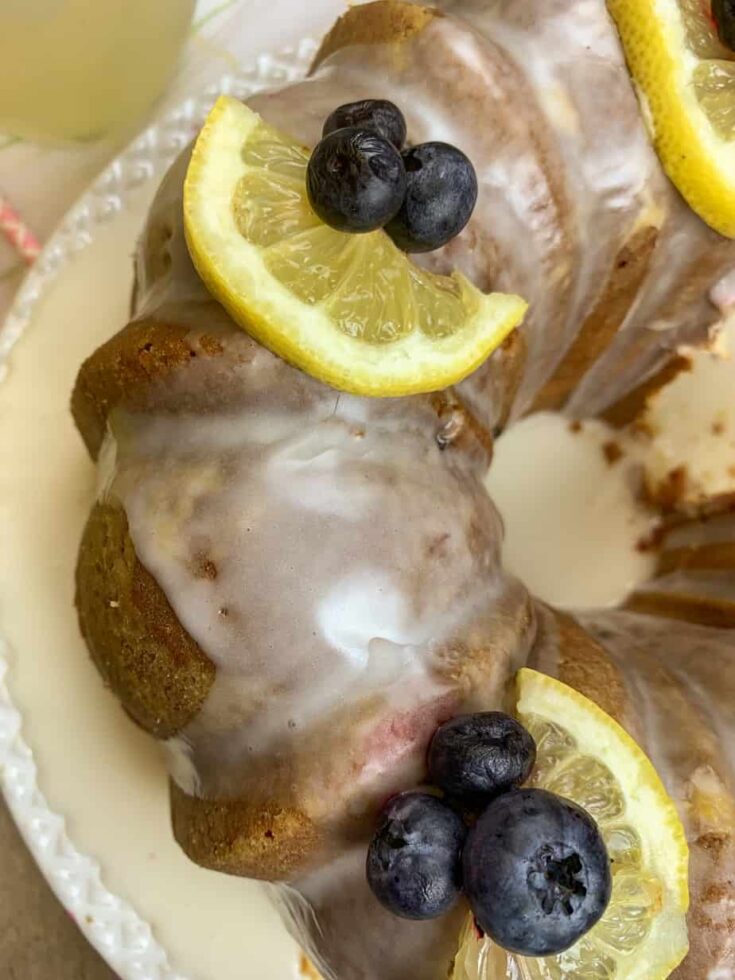 Bundt cake with lemons and blueberries on top