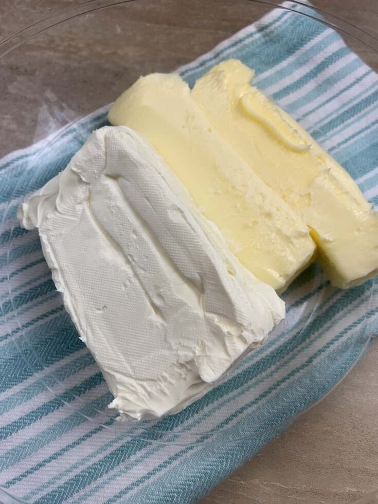 Cream cheese and butter in a glass bowl