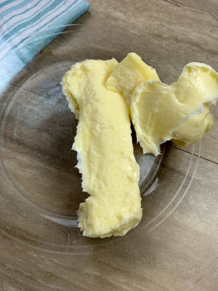 Softened butter in a glass bowl