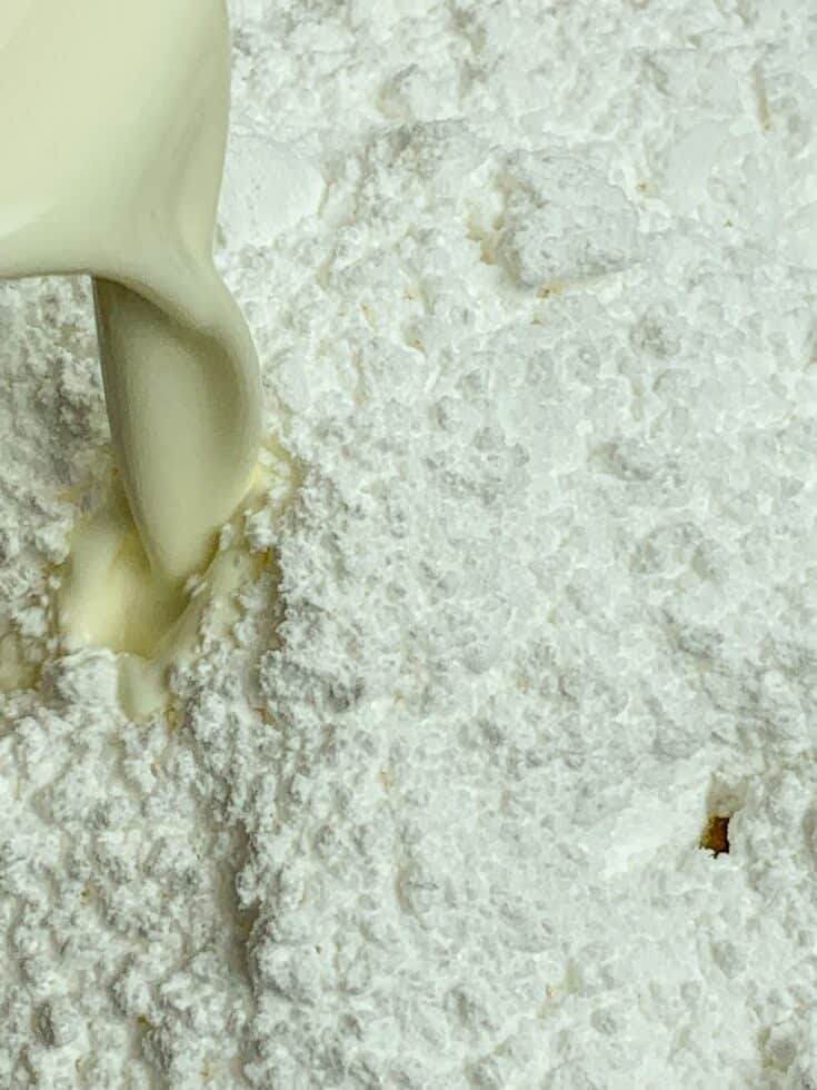 Buttermilk, powdered sugar, and butter in a bowl