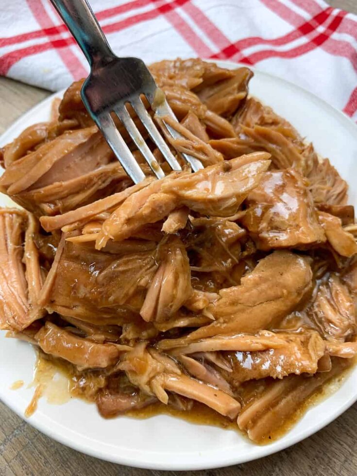 Pork chops on a plate with a fork