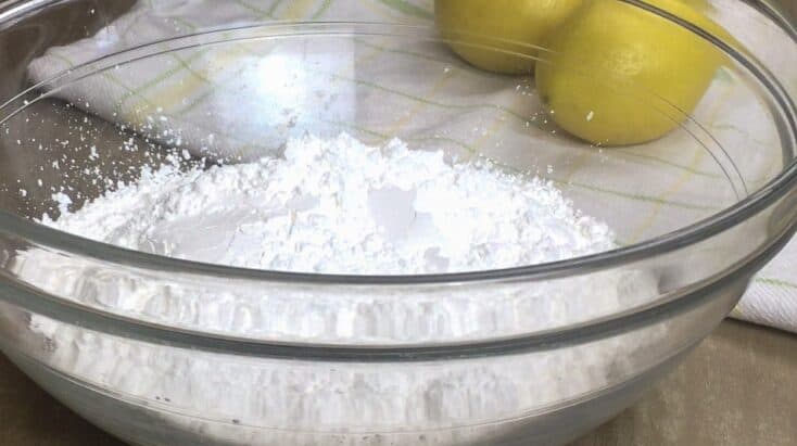 Powdered sugar and lemon juice in a bowl