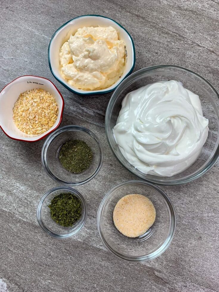 Six ingredients in bowls for sour cream dip