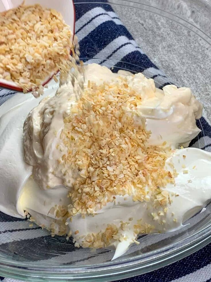 Sour cream, mayonnaise, and seasonings in a large bowl