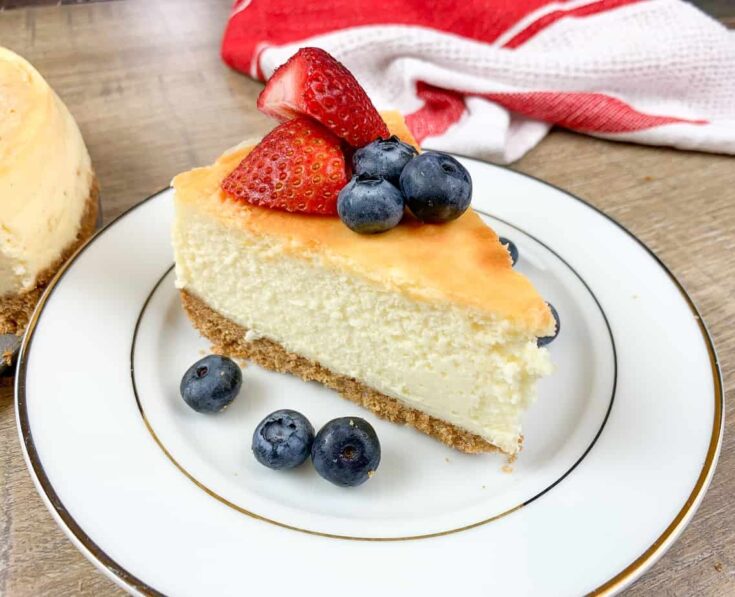 Cheesecake with fruit on top of a plate