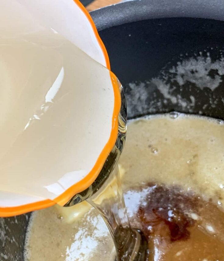 Light corn syrup being poured into a saucepan