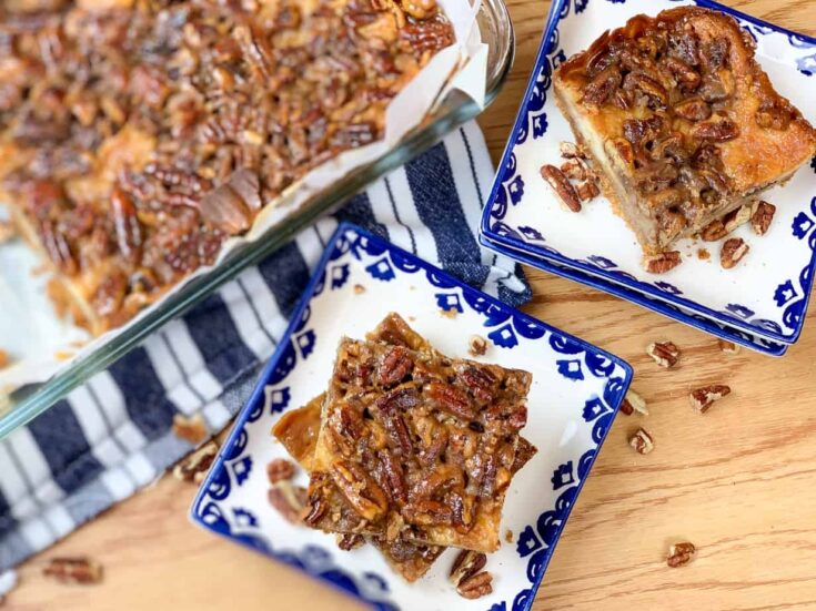 Pecan pie cheesecake bars on plates