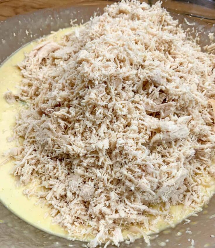 Shredded chicken in a glass bowl