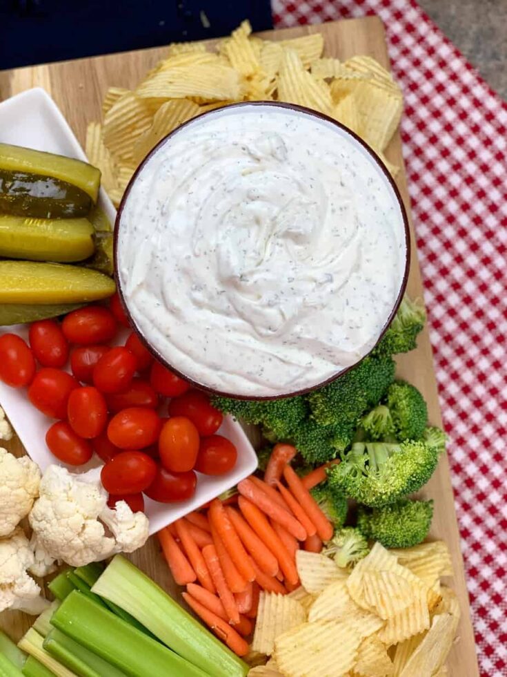 Sour cream dip with veggies and chips