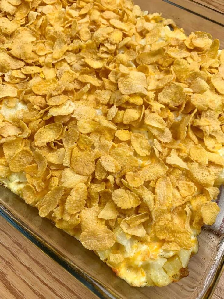 Corn Flakes on top of potatoes in a casserole dish