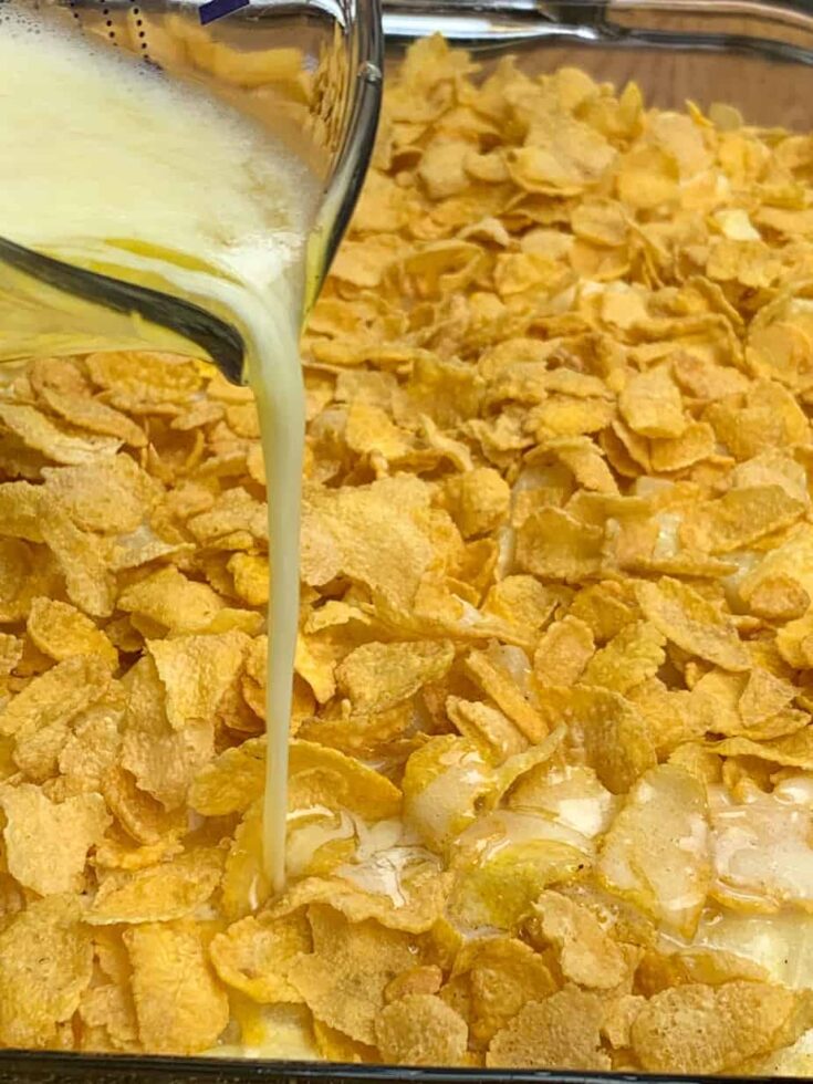 Melted butter being poured over the top of Corn Flakes