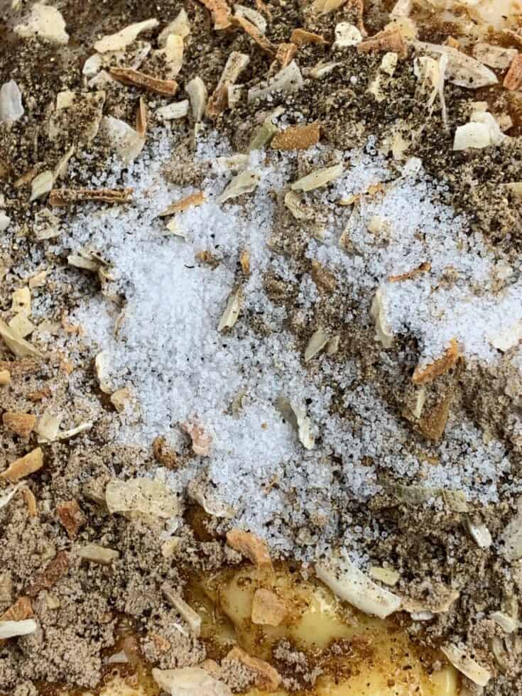 Onion mix, salt, pepper, and cream of chicken and mushroom soup in a bowl