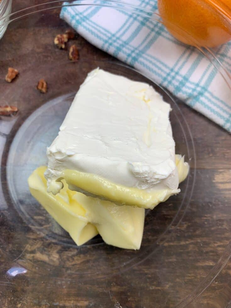 Softened butter and cream cheese in a glass bowl