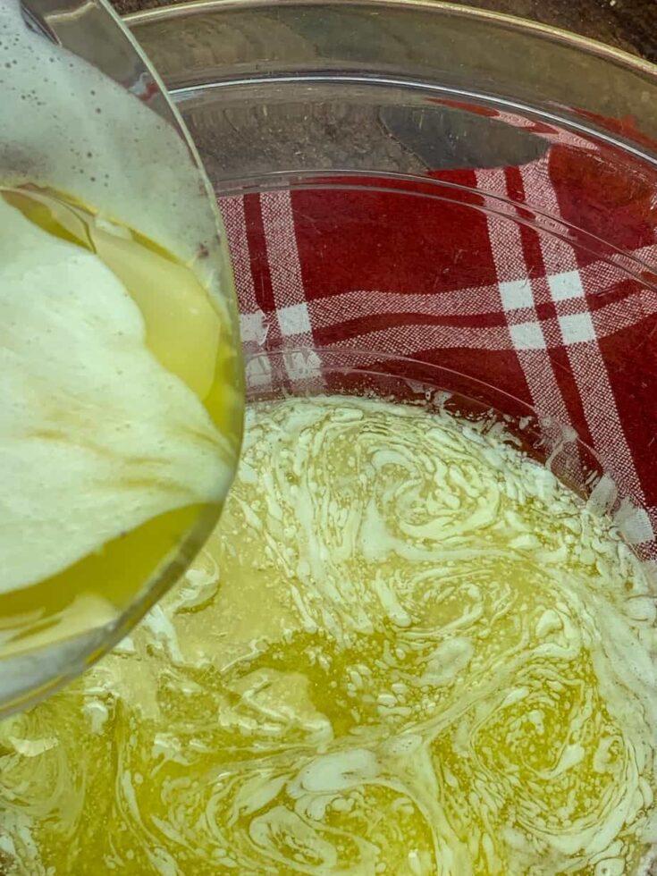 Melted butter being poured into a bowl