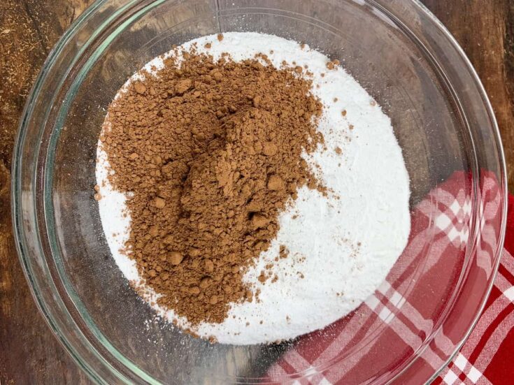 Powdered sugar and unsweetened cocoa in a glass bowl