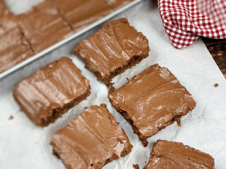 Frosted brownies on a counter