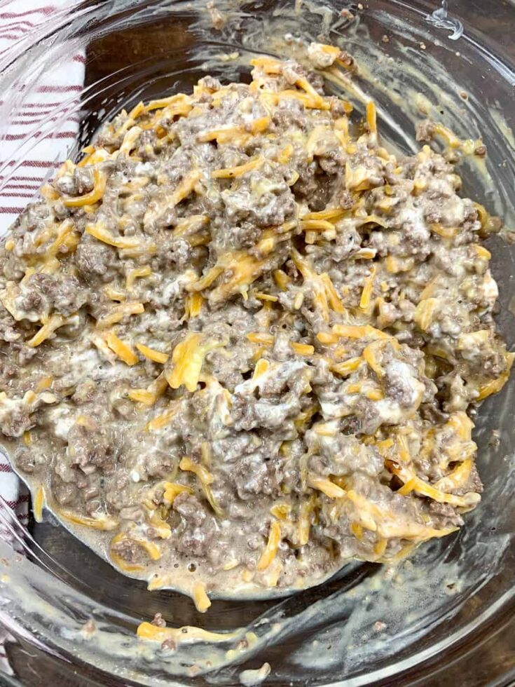 Ground beef casserole mixed up in a large glass bowl