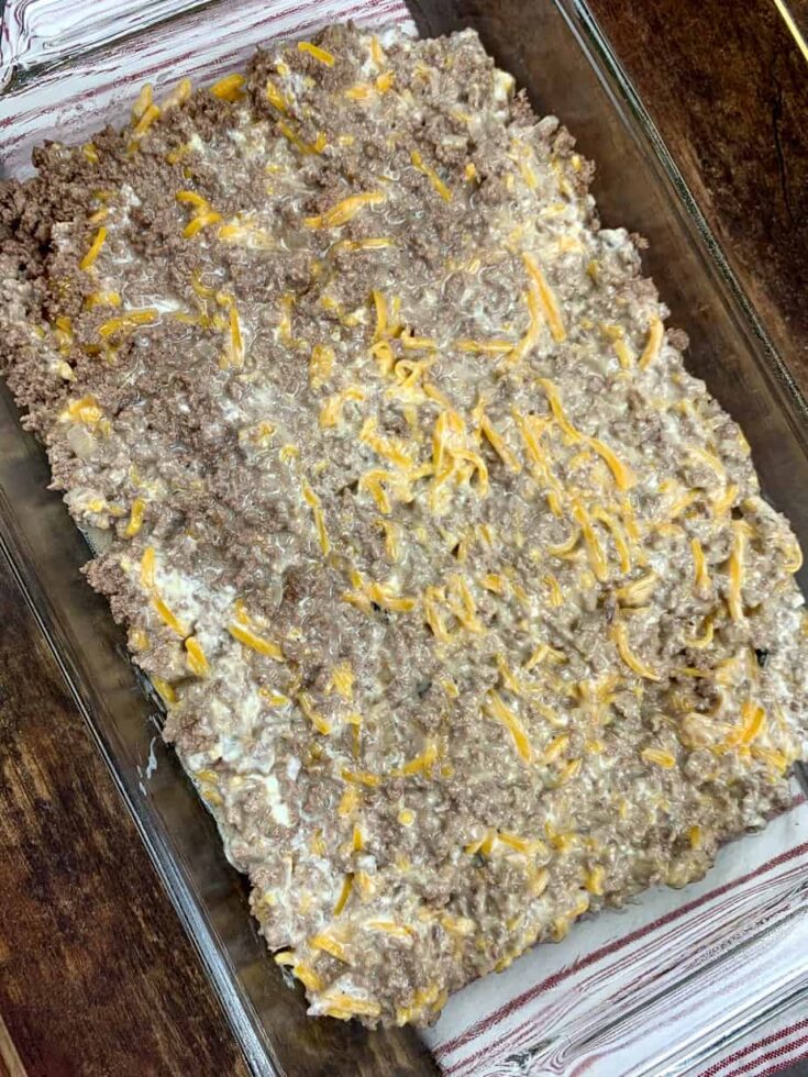 Tater tot casserole spread out in a casserole dish