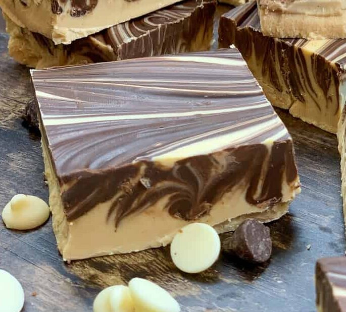 Peanut butter and chocolate fudge on a counter top.