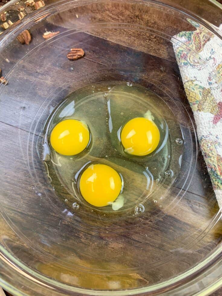 Three eggs in a glass bowl