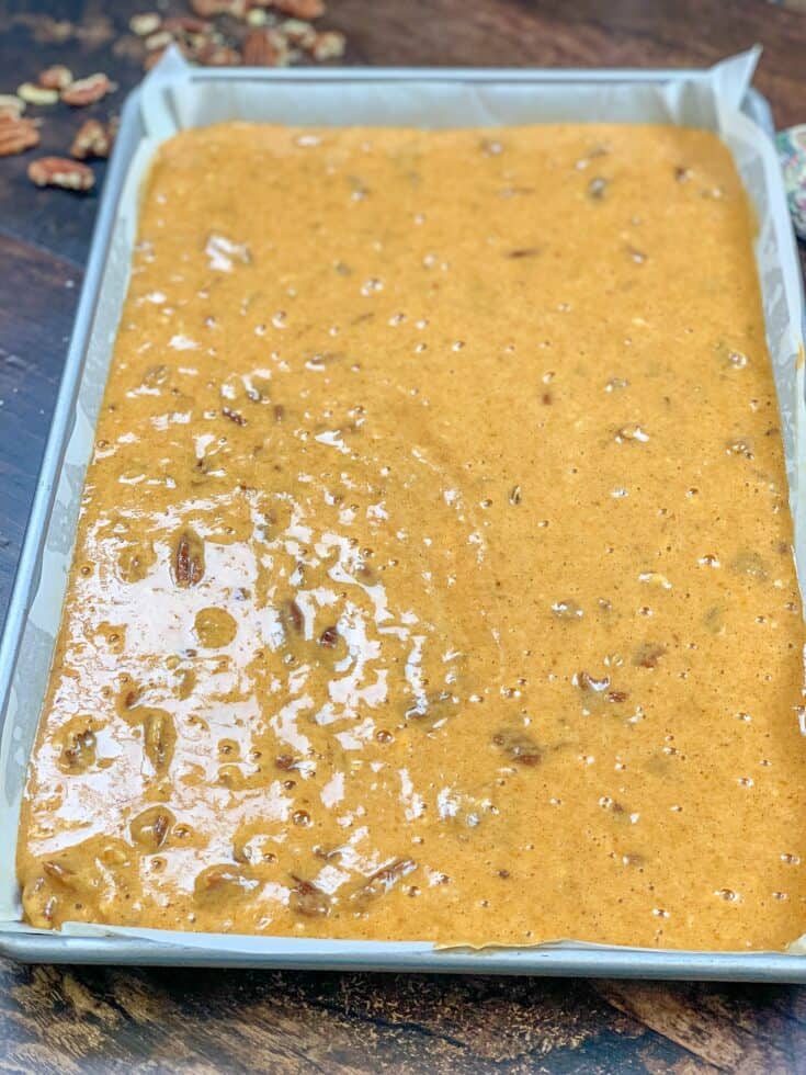 Pumpkin roll batter in a jelly roll pan.