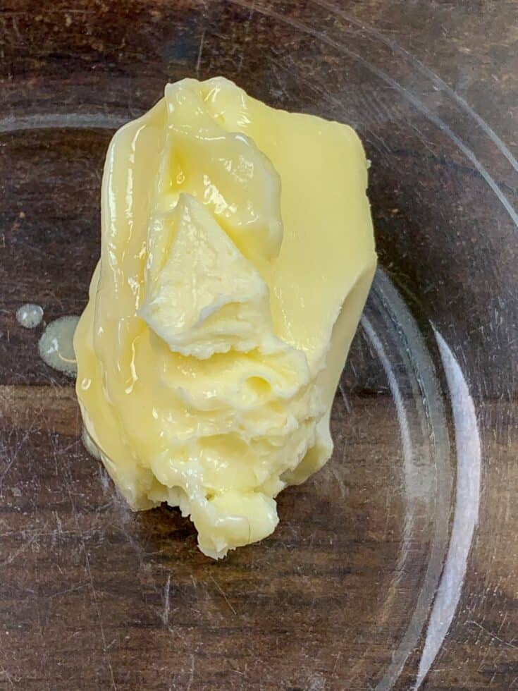 Softened butter in a glass bowl