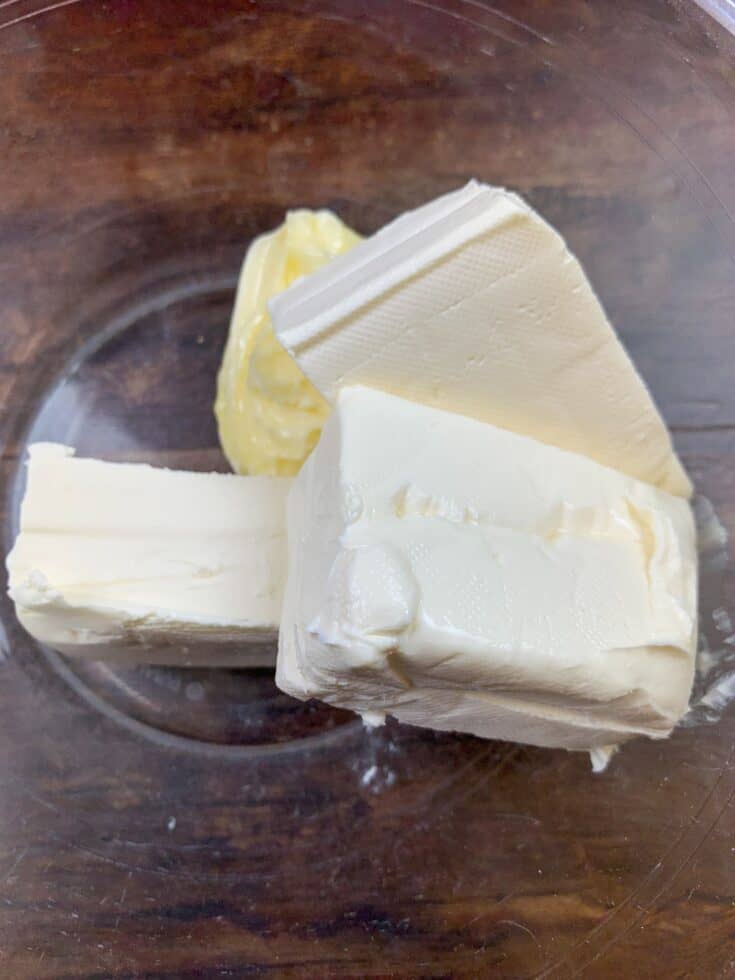 Butter and cream cheese in a glass bowl