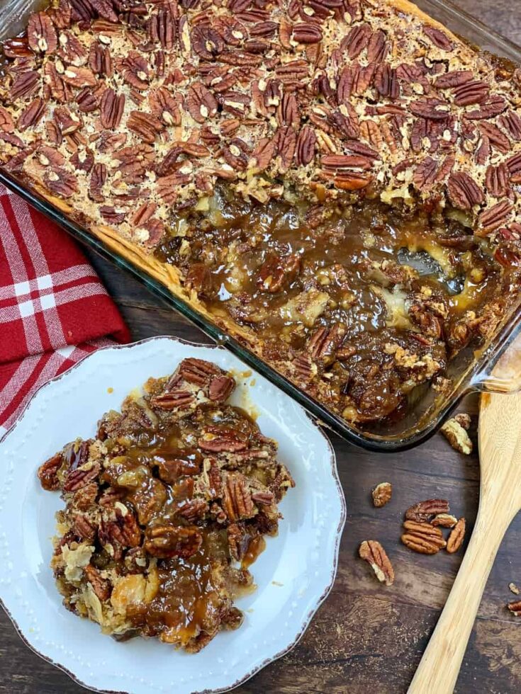 Pecan pie cobbler in a white plate and in a casserole dish