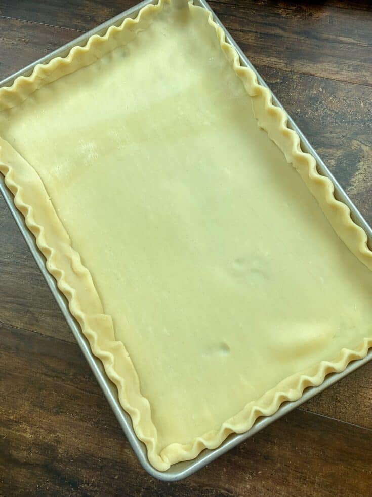 Pie crust rolled out in a jelly roll pan