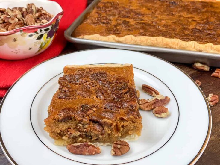 Pumpkin pecan pie on a plate